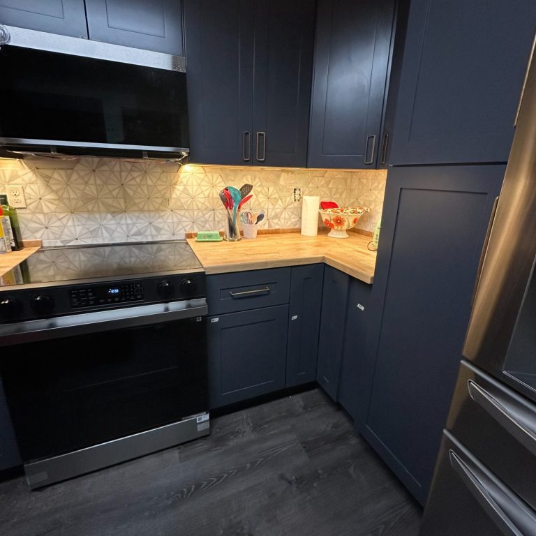 intricate pinwheel mosaic backsplash, under-cabinet LED lighting, Dark Grey Luxury Vinyl Plank flooring